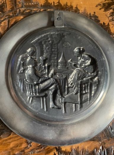 Vintage pewter wall hanging plates
