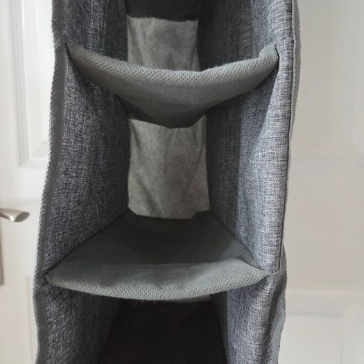 Grey fabric hanging closet organizer with 6 open shelves and side mesh pockets