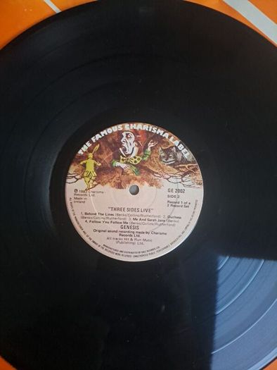 Genesis three sides live . Irish press on The famous Charisma label No sleeve . record 1 of a 2 record set