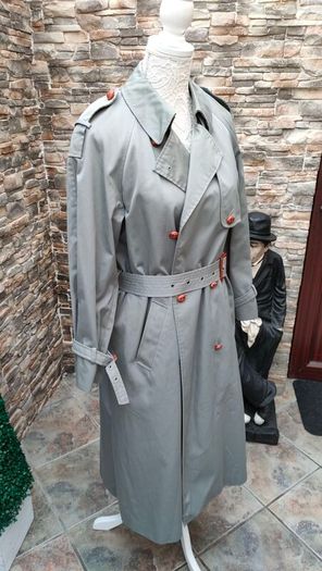 Vintage Nuage ladies trenchcoat Approximately late 90s early 00s Size 10 on label The colour is a pale bluey grey with brown buttons It's got an inner lining that can be removed