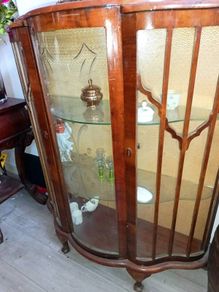 Antique cabinet with wavy shelves