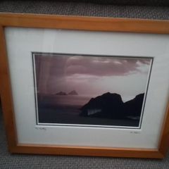 Framed photo of the Skelligs from the land side.