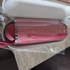 Umbrella with protective zip case. Burgundy/red colour, lightweight and easy to carry in a handbag or backpack. Brand new and unused.