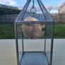 Table clock in a glass lantern. Image 3