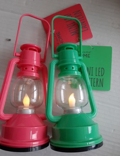 2 small plastic garden lanters tags attached