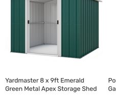 Green metal garden shed