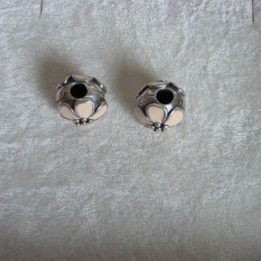 Pandora cherry blossom clips charm, featuring smooth cream enamel petals and a sterling silver beaded center very good condition