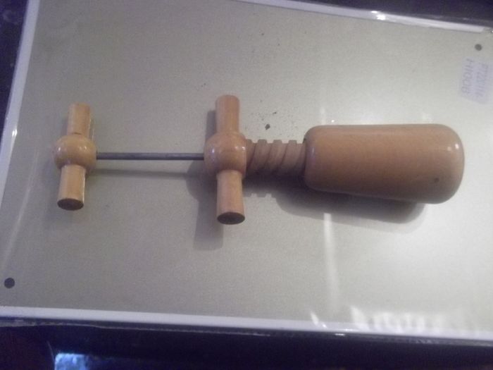 a vintage wooden  cork screew working