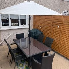 Garden furniture table and chairs, parasol and weighted base