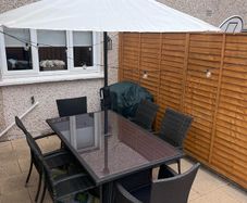 garden furniture table and chairs, parasol and parasol weight