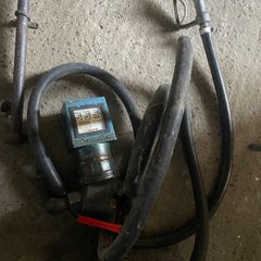 Oil tank fuel dispenser clock