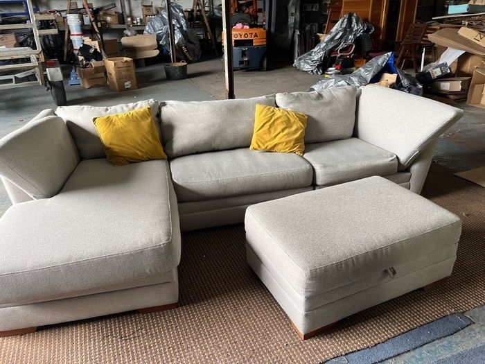 Grey corner sofa with matching footstool