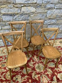 Set of 4 Bentwood chairs with X-back design.