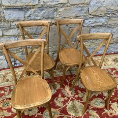 Set of 4 Bentwood chairs with X-back design.