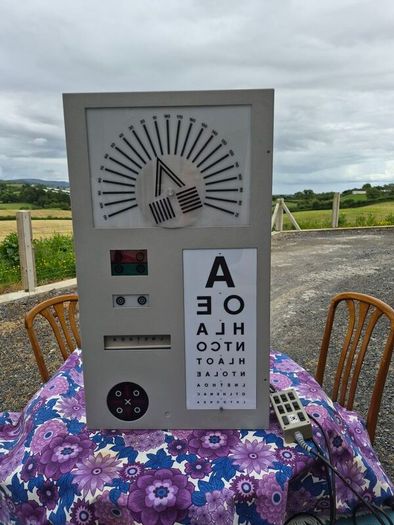 vintage optician's illuminated eye test chart, commonly used in the mid-20th century.