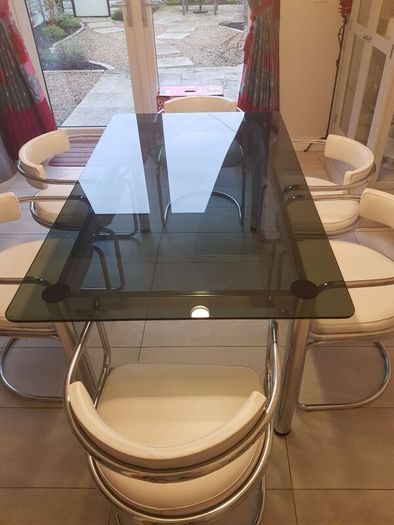 Table and 6 white leather chairs