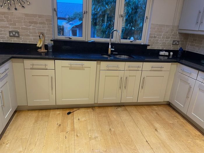 Entire kitchen Quartz work top solid wooden shaker style doors