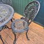 Garden table and 4 Chairs (ornate cast aluminium) Image 4