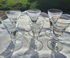 A Set of Cumbria Ware Hand Blown Toasting Glasses