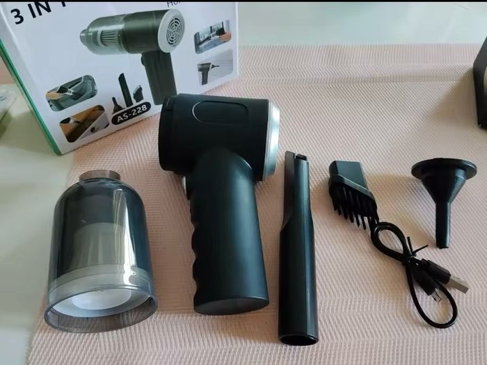 Portable handheld vacuum cleaner perfect for car and home use.