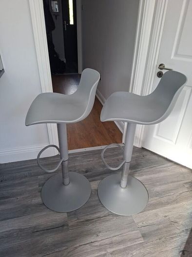Two adjustable grey breakfast bar stools