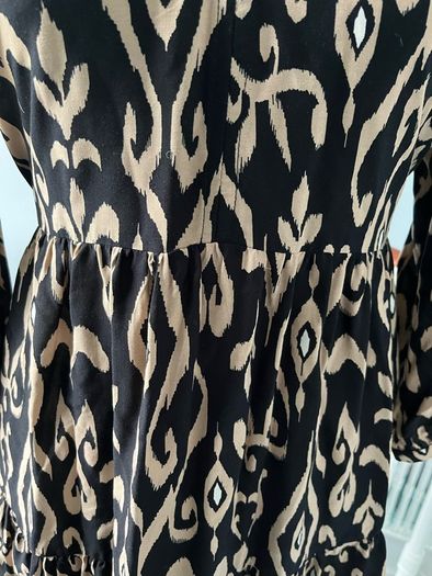 Brand new black and beige long sleeved mini dress