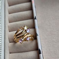 The ring has a unique stacked design with several bands and beautiful pastel/coloured stones, including purple, green and champagne tones. The hallmark has worn away over time, but the ring was tested today and confirmed as genuine 14K gold weight 3.95g.