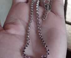 Beautiful necklace in silver tone with pink crystals in the form of flowers.