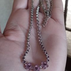 Beautiful necklace in silver tone with pink crystals in the form of flowers.