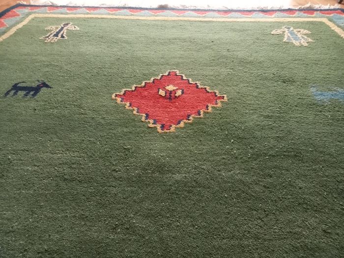 hand-knotted green Gabbeh rug