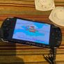 PSP  Console plus 10 games, charger and headphones Image 5