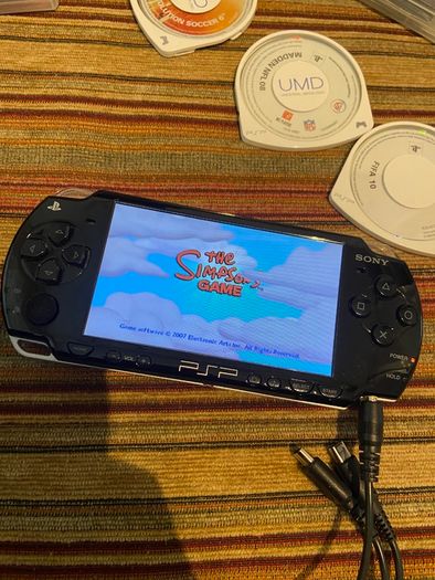 PSP  Console plus 10 games, charger and headphones
