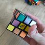 Collection of various puzzle cubes Image 7