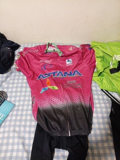 2 cycling shirts 1 is cube worth easily 50 euro and is brand new and pants with padding for on the saddle brand new never worn the second shirt is the official astana team training shirt also brand new  is the  would like to sell all together for a good p