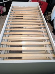 White single bed with underneath pull out bed and 2 storage draws