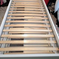 White single bed with underneath pull out bed and 2 storage draws
