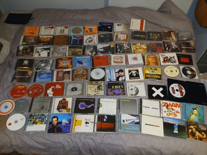 Collection of 58 assorted music CDs