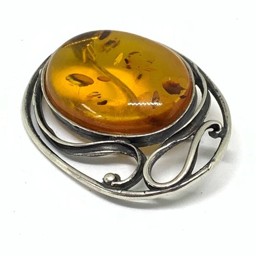 Art Nouveau silver brooch with Amber
