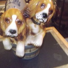 a vintag ornament off two  dogs