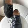 Black Doc Martin shoes. Image 3