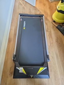 Folding Treadmill with remote control and manually adjustable incline.