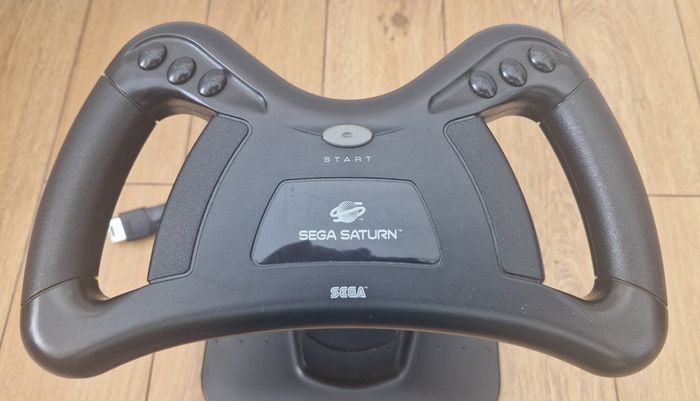 Sega Saturn w/ 3D Control Pad, Arcade Racer, Lightgun and Games