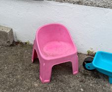 kids chair and toy wheel barrow