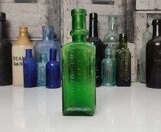 396 - Antique Aceite De Bellotas y Savia De Coco Green Glass Bottle