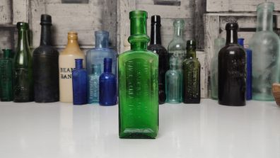 396 - Antique Aceite De Bellotas y Savia De Coco Green Glass Bottle