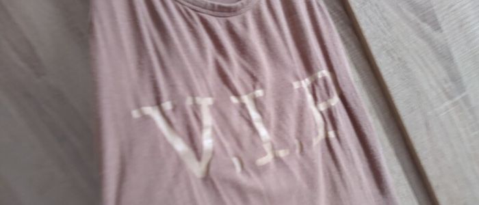 VIP tank top fits size  8/10