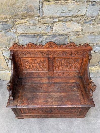 Late Victorian Gothic Revival Carved Oak Hall Settle.