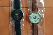 2 mens watches with leather straps.