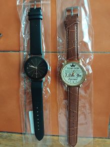 2 mens watches with leather straps.
