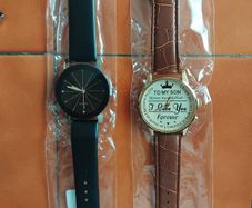 2 mens watches with leather straps.